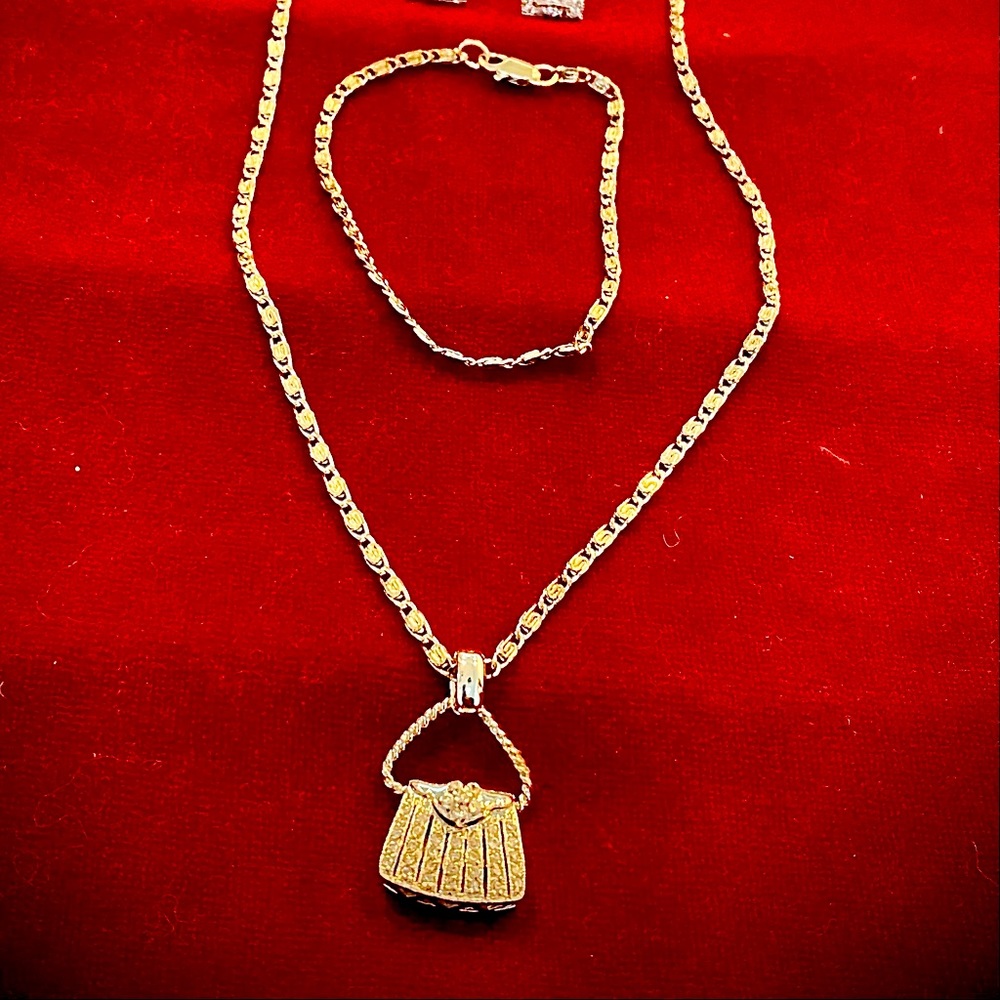 Necklace, bracelet, and earrings set.